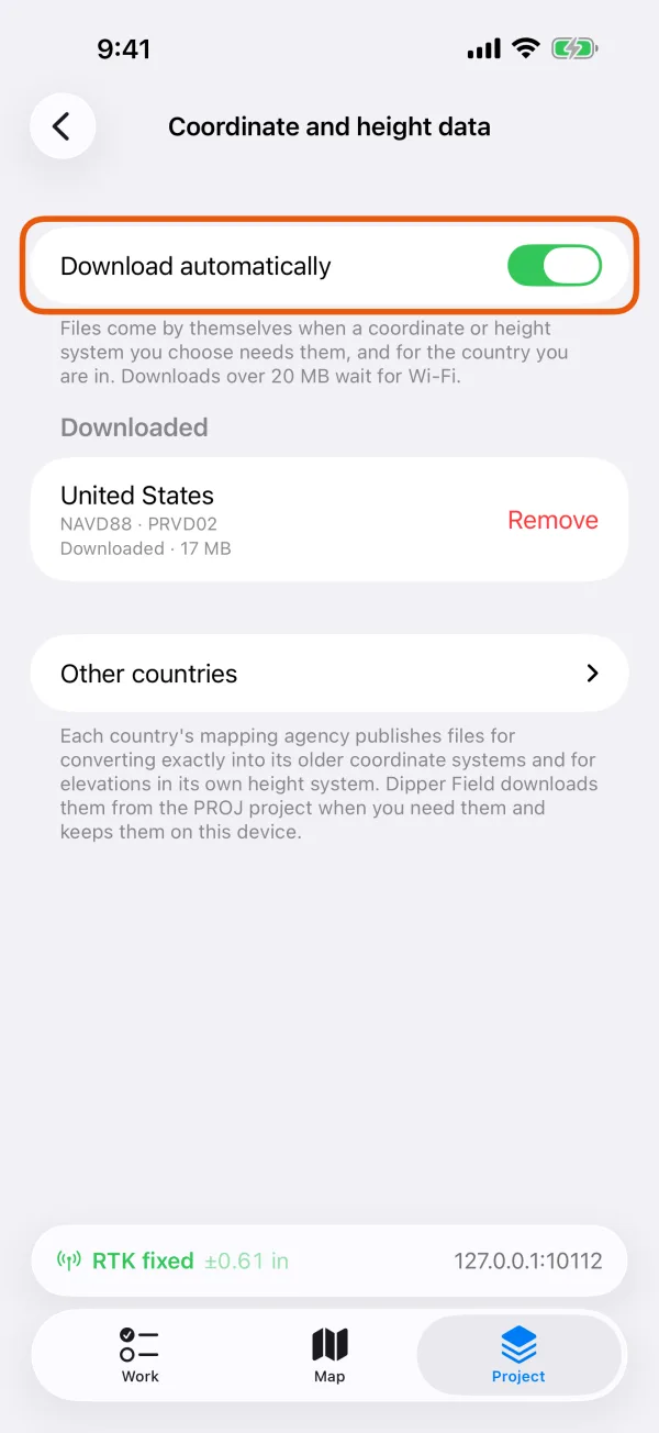 The Download automatically switch, with the downloaded sets below it.
